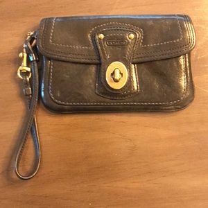 VINTAGE 1990s black leather Coach Signature wristlet, legacy stripe interior.